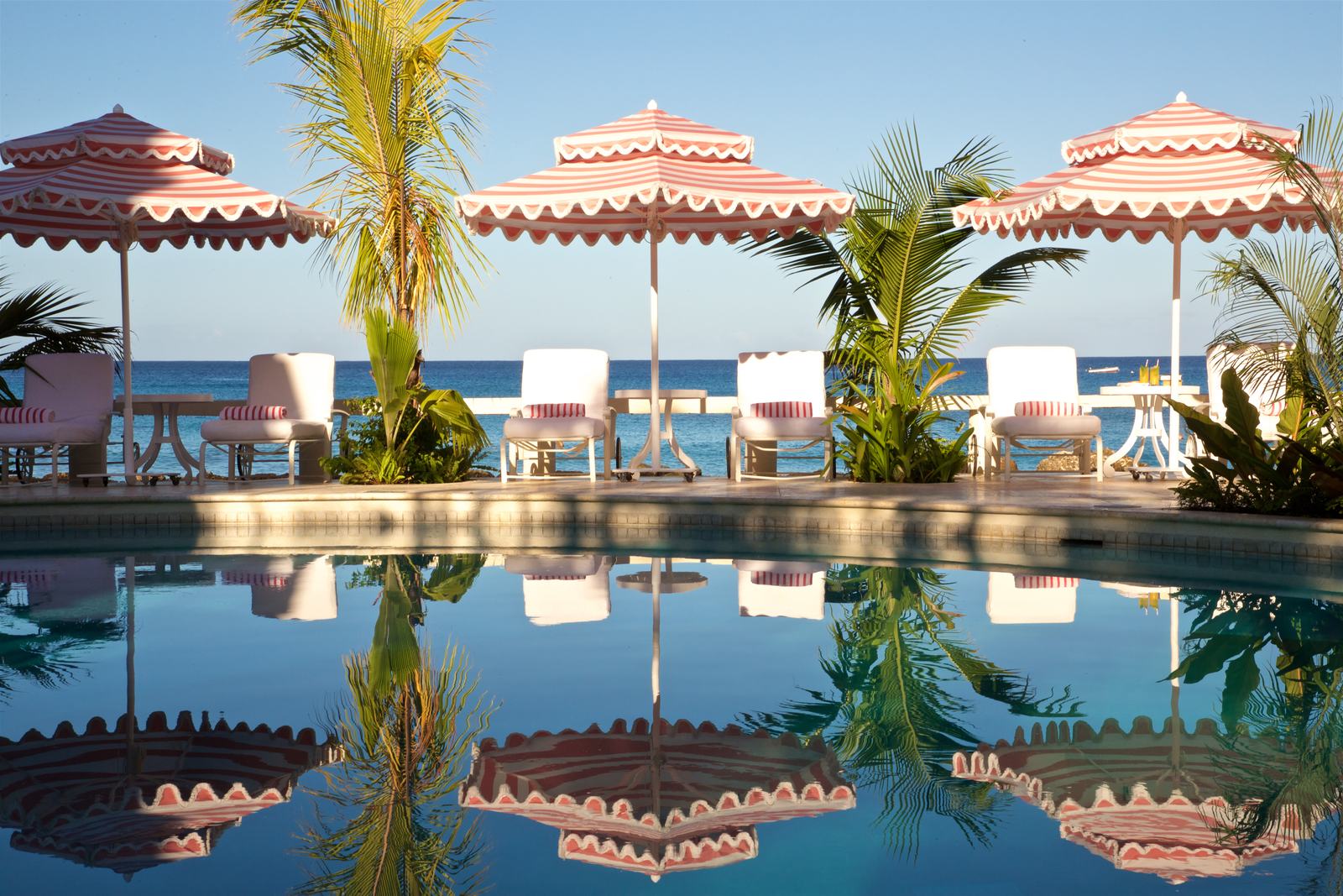 Striped umbrellas by the pool at Cobblers Cove