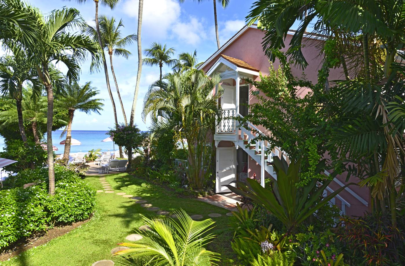 A path through the gardens to the beach at Cobblers Cove